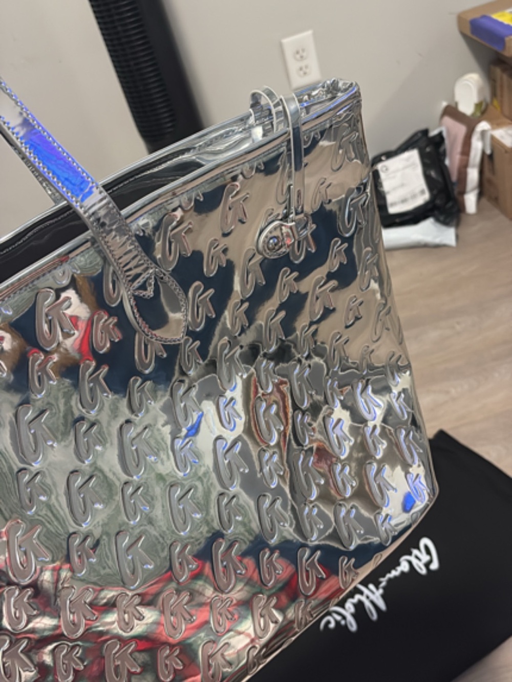 Shimmering Silver Tote with Embossed Monogram Pattern